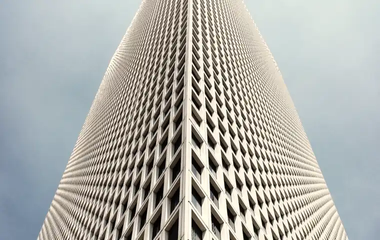 A tower facade receding upward in even bays.